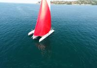 trimaran sailing with gennaker aerial photo